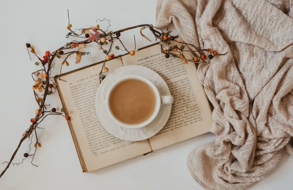Simple necklace, book and coffee as low-clutter birthday gifts