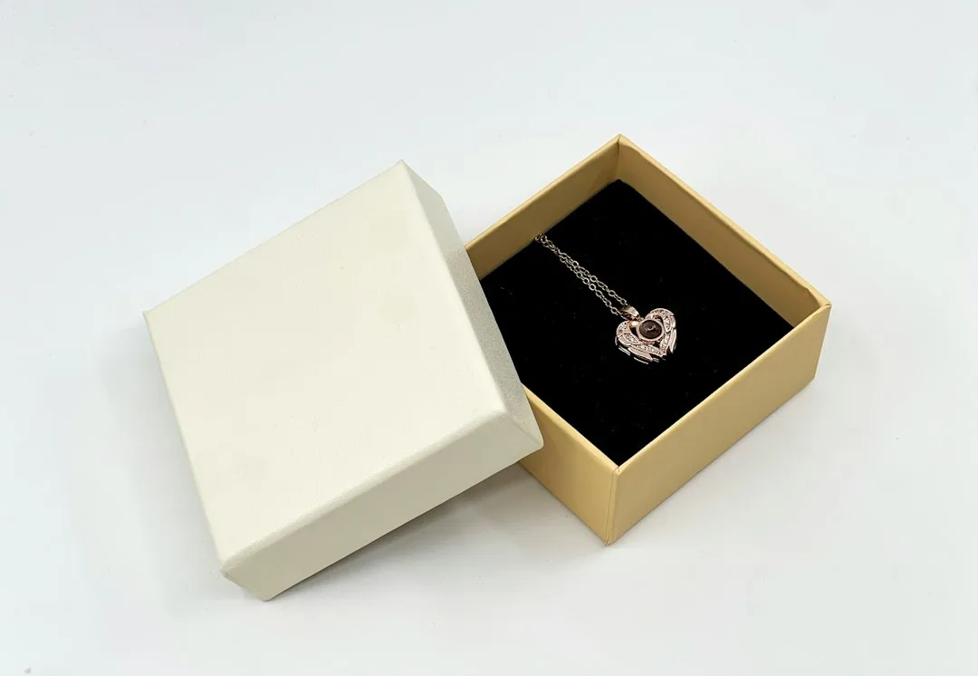 Pearl jewelry arranged beside an open gift box