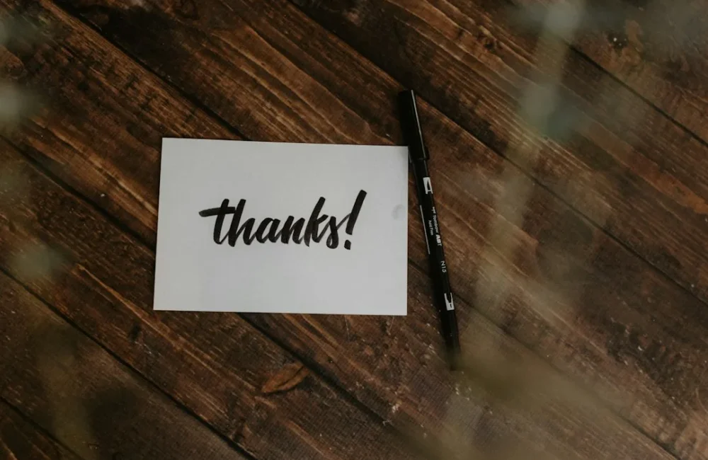 Handwritten thank-you note and pen for a teacher gift