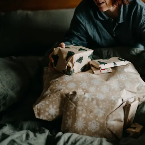 A father-in-law opening a birthday gift, illustrating thoughtful gifts for a father-in-law on his birthday