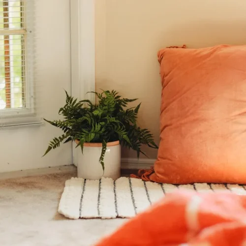 Peaceful reading nook with soft lighting and comfortable blanket, ideal setting for introvert relaxation