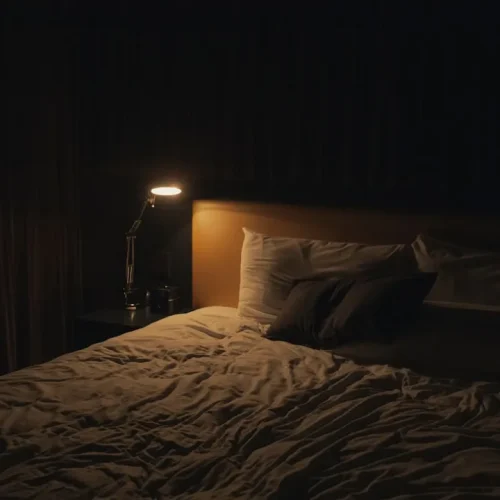 Peaceful bedroom with quality linen bedding and warm ambient lighting for sleep lovers