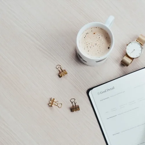 Carefully arranged morning routine essentials including premium coffee, leather planner, and soft natural light representing gifts for people who love routines
