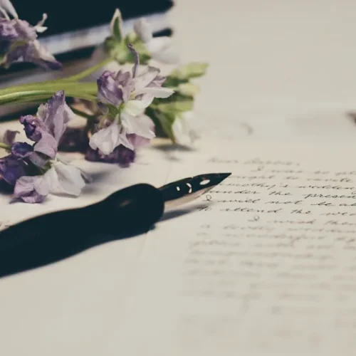 Person writing a handwritten letter with fountain pen showing the meaning of receiving personal correspondence