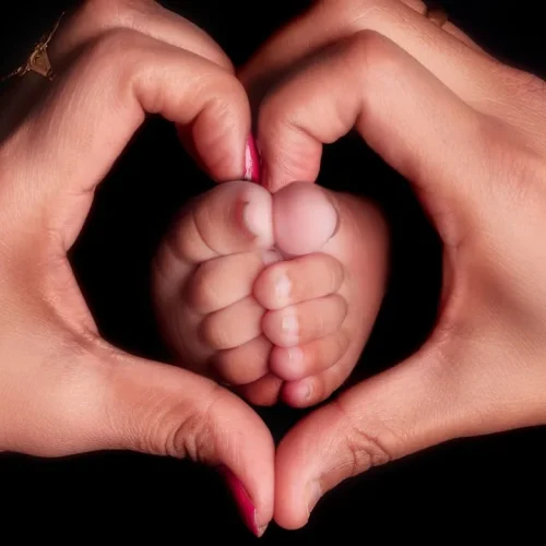 Thoughtful sentimental gifts for new moms displayed beautifully with baby items