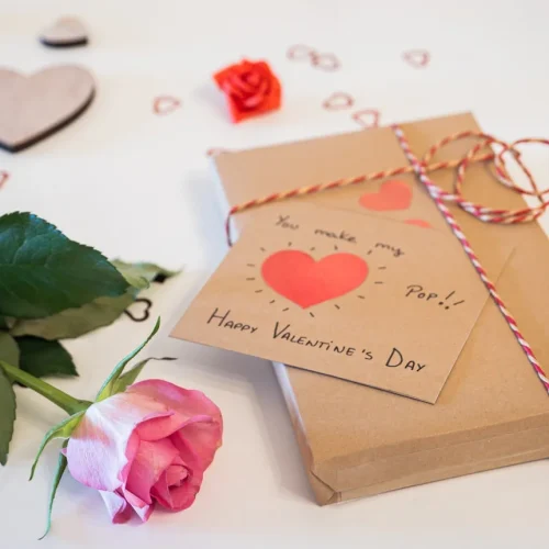 Collection of handmade sentimental gifts that are not expensive including photo albums, handwritten letters and personalized crafts