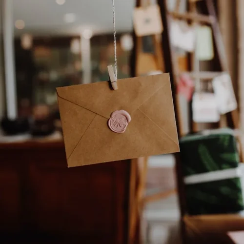 Collection of handwritten open when letters in decorative envelopes arranged in a gift box